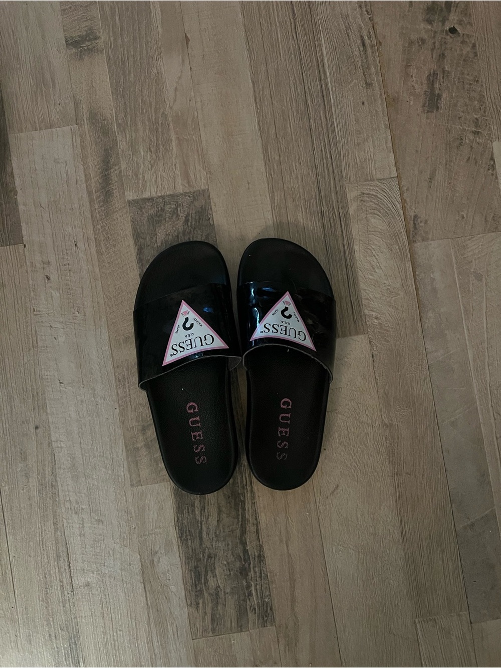 GUESS Black Patent Slide Sandals with Pink Logo Triangle